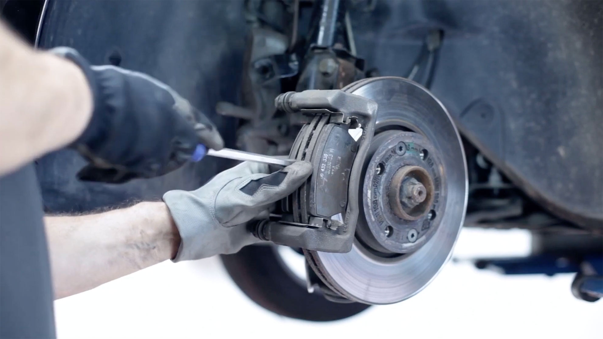Changing brake pads in a workshop